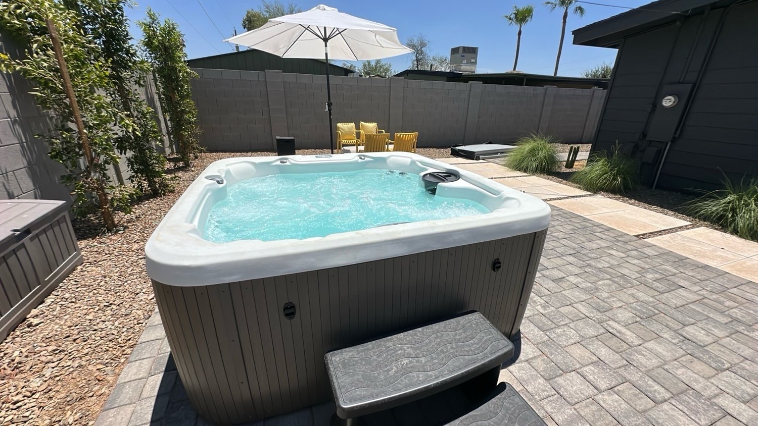 Hot tub in backyard patio oasis