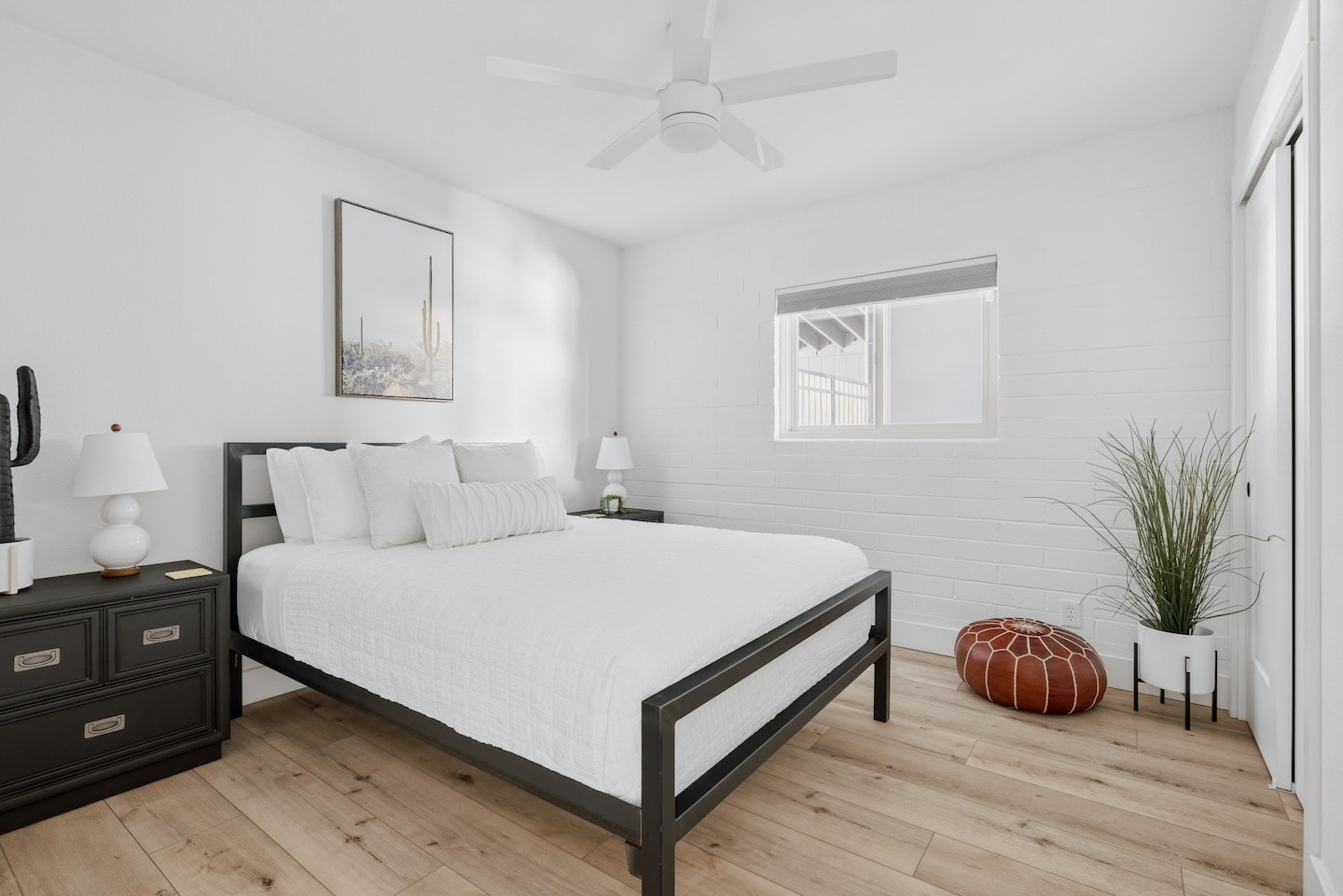 Modern bedroom with black metal bed frame
