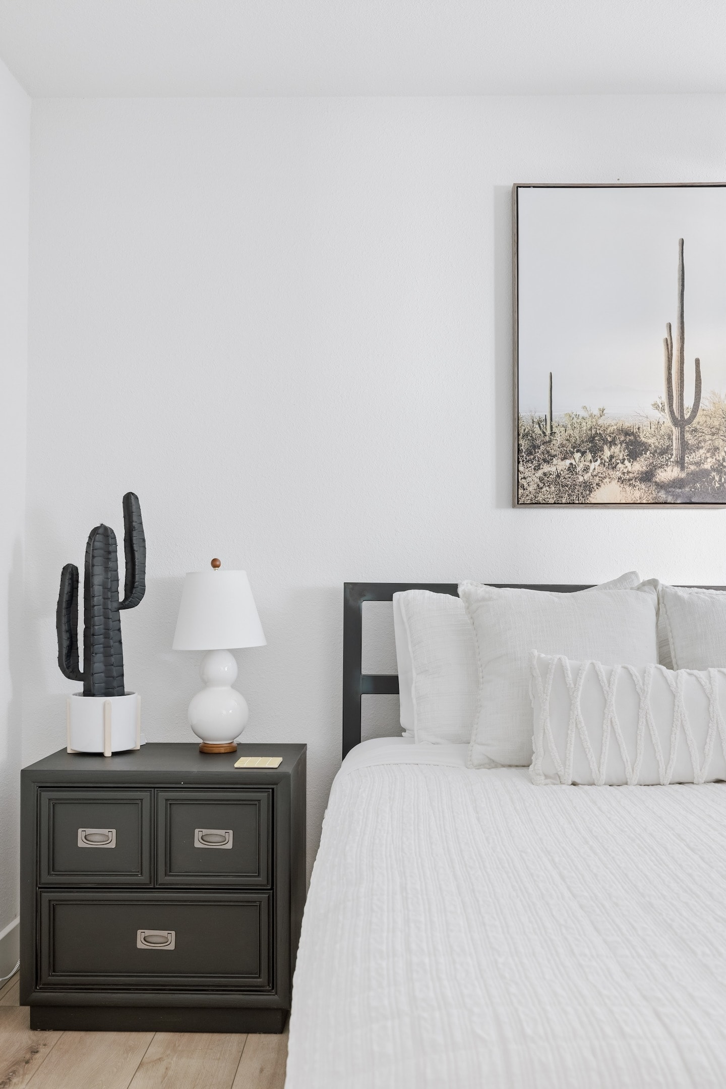 Minimalist bedroom with cactus decor